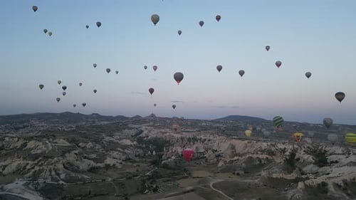 Aerial video over monoliths in Cappadocia, on hot air balloons, Turkey