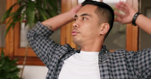 Mental health, stress and anxiety with man looking worried and overwhelmed in a yard at home