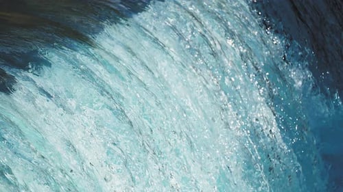 Slow motion shot of the transparent clean falling water. Close-up, Loop. High-quality 4k foota