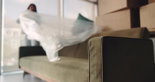 Woman Unpacking Furniture in Bright, Modern Apartment