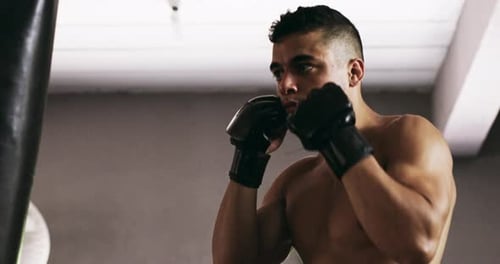 4k video footage of a young male boxer practicing in the gym