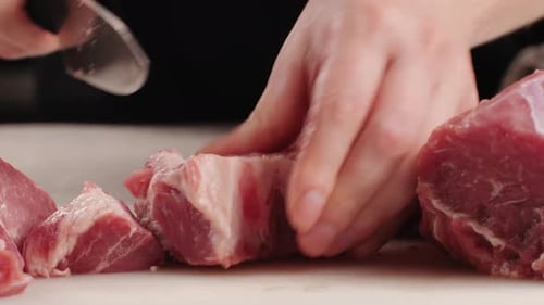 Chef Butcher Cutting Pork Meat with Knife on Kitchen Cooking Mexican Traditional Food Man Cut Big