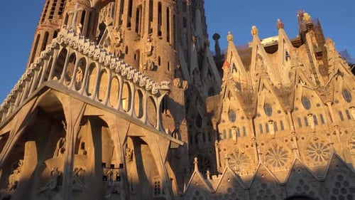 Sagrada Familia South Western Side lit by a Low Sun (Vertical Pan, 4K)