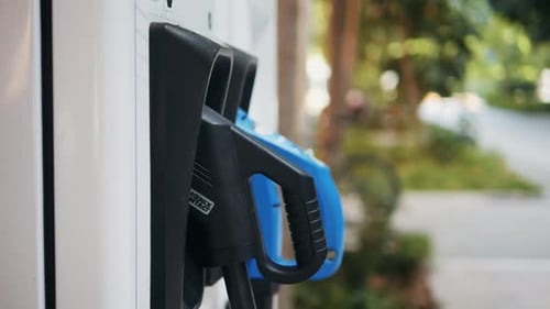 A Modern Electric Vehicle Charging Station Strategically Located in an Urban Setting for Convenience