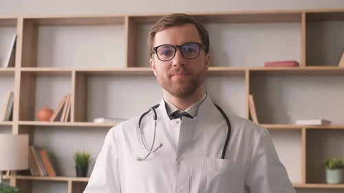 Confident Doctor Smiling in Office Wearing Stethoscope