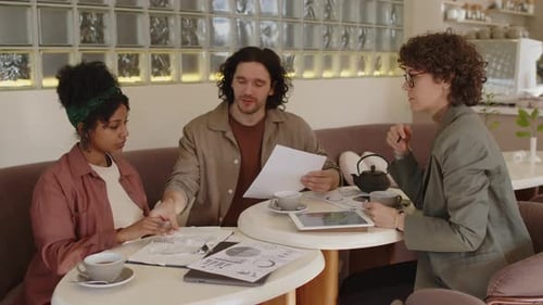 Cafe Owners Having Consultation with Business Advisor