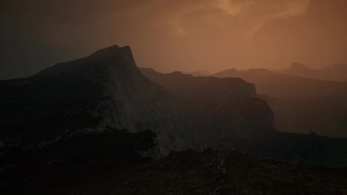 Dramatic Sky Over Rocky Mountains at Sunset