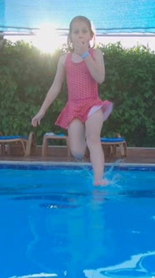 Cute Girl Child Fun Jump in Swimming Pool