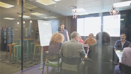 Business Meeting with Presentation in Modern Office