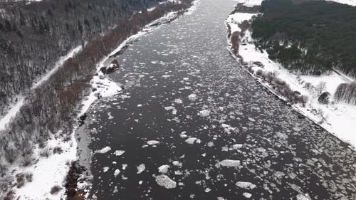 Drone Shot of Icy River in Winter Landscape