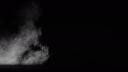 Mojave Collection: Dust smoke with small debris blowing over a flat surface shot at 60fps