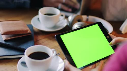 Chroma key, tablet and green screen with mockup of a monitor of a woman in a coffee shop