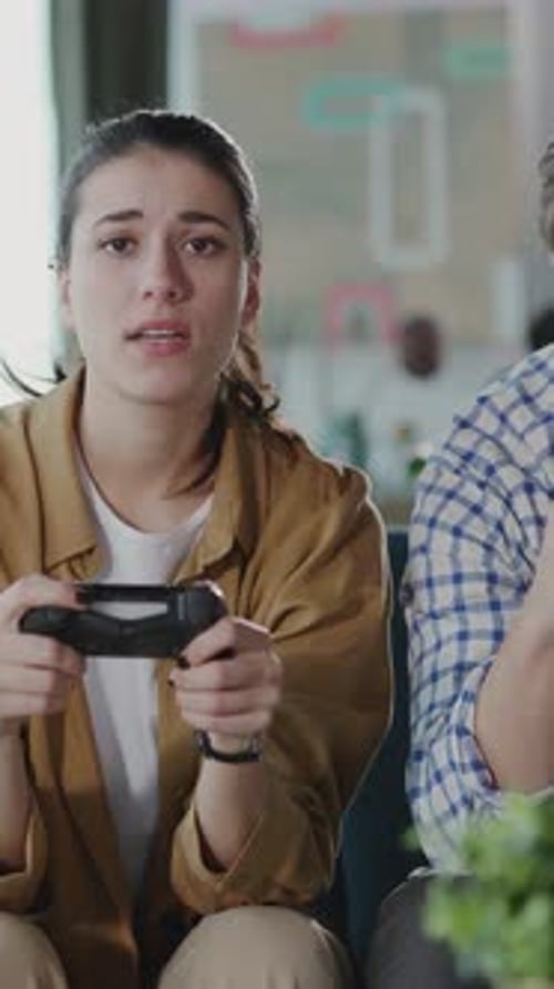 Friends Playing Video Games Together at Home