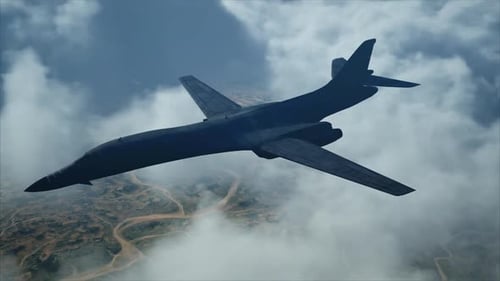 Military Bomber Aircraft Flying Above Clouds and Landscape