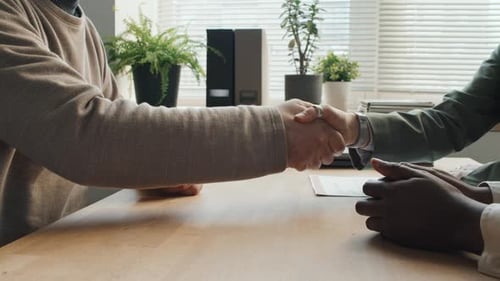 Business Handshake in Bright Office Environment