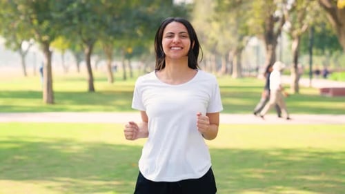 Woman Exercising Outdoors in City Park