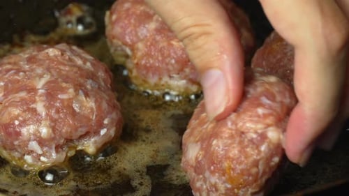 Meat patties or cutlets in form of cutlets, fried in oil in pan,