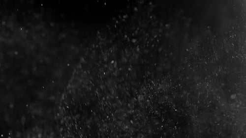 Sparkling Particles on Black Background