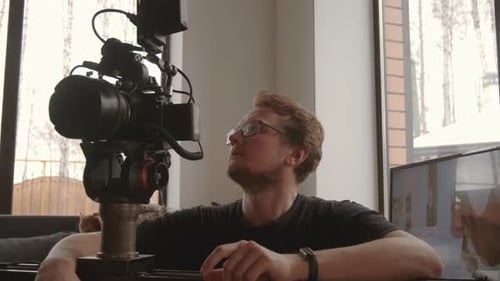 Man with Large Camera Dolly in House