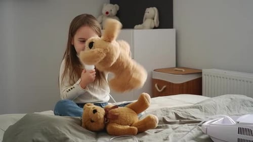 Girl Uses Nebulizer at Home with Toys
