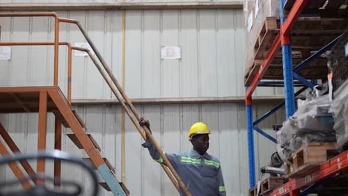 Warehouse Industrial and Logistics Companies. Dispatcher in uniform making inventory in storehouse.