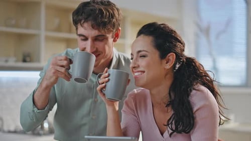 Happy Couple Drinking Coffee Together in Sunny Kitchen