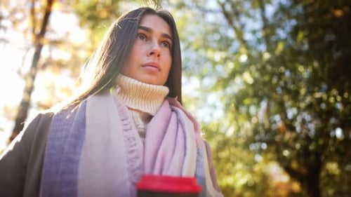 Portrait Caucasian Charming Lovely Dreamy Lady Hand Hold Glass Coffee and Enjoy Drink in Autumn Park