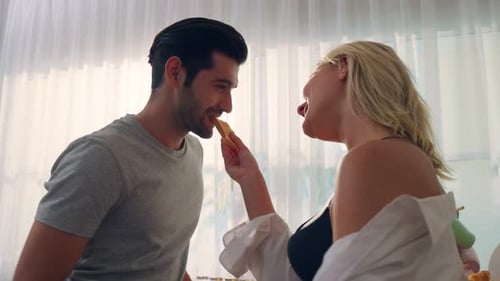 Loving Couple Enjoying Breakfast Together Indoors