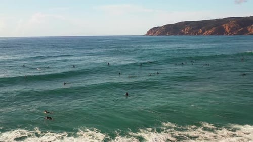 Aerial View Flyover Surfer in Ocean with Giant Waves