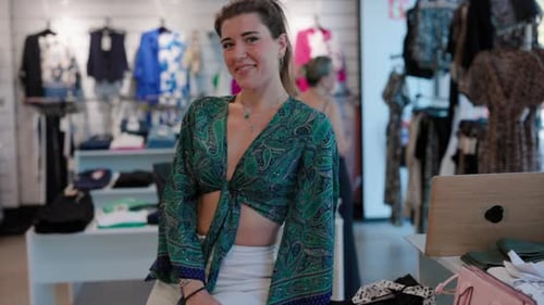 Smiling Clothing Store Employee in Trendy Boutique