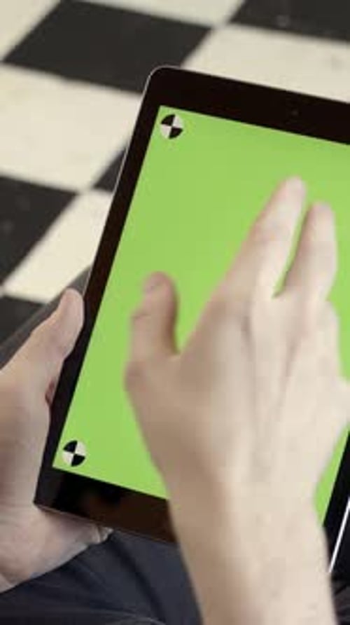 Closeup of Man Holding Tablet and Touching Green Screen Stock Fooatge Young Freelancer Uses Tablet