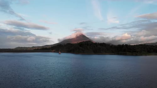 Majestic View Of Arenal Volcano With Serene Lake And Beautiful Sky On The Background In Costa Rica.