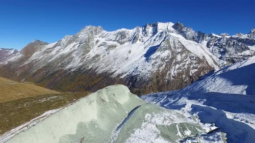 Majestic Snow-Capped Mountains Under a Clear Blue Sky