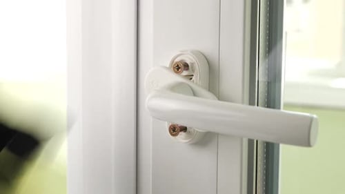 Installing a Window Handle with a Screwdriver