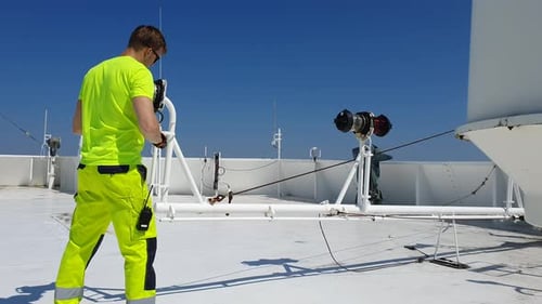 Navigation officer carrying out routine maintenance of navigational equipment