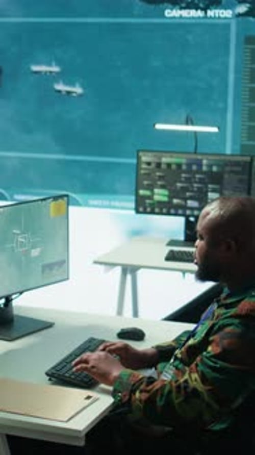 Man Typing at Computer in Modern Office