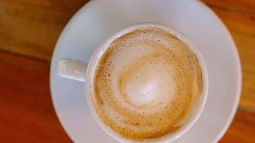 Close Up of Cappuccino on Wooden Table