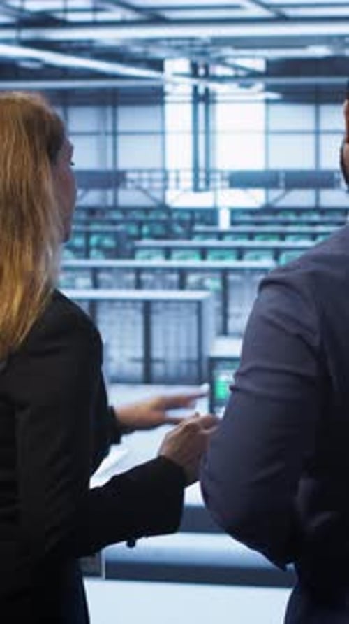 Vertical Video IT Expert and Colleague Supervising Data Center Establishment