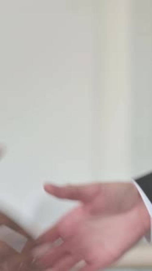 Close up of Young Business People Shaking Hand, Collaboration, Vertical Video