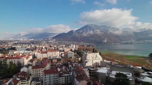 Town in the French Alps, Annecy, with Lac Annecy and Mount Veyrier, drone shot