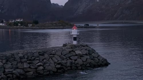 Scenic Lighthouse Position in Reine Along Norway's Rocky Coast
