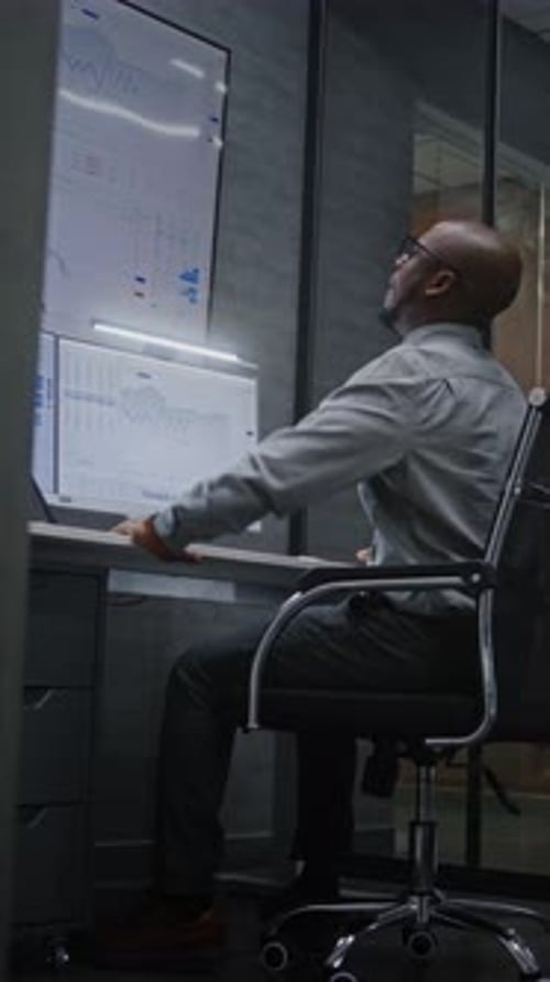 Happy Stock Trader Monitoring RealTime Stocks Having Phone Call Celebrating Winning Trading Deal