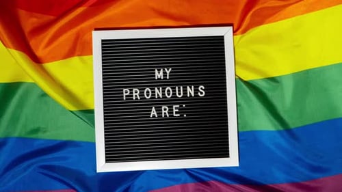 Stop Motion of MY PRONOUNS ARE Text Neo Pronouns Concept on Rainbow Flag Background Gender Pronouns