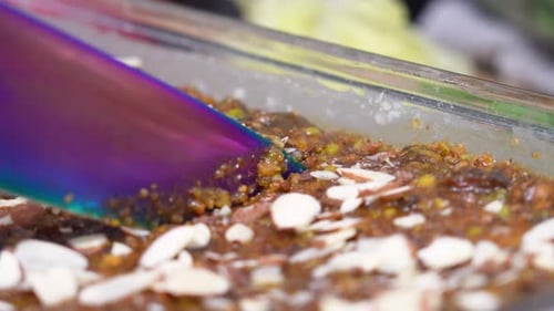 Preparing Delicious Food with Almonds in Baking Dish