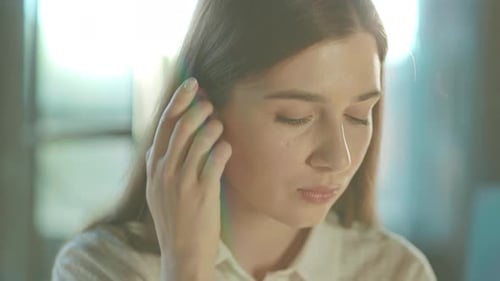 Portrait of a Beautiful Young Woman Turning Head Looking at Camera in Sunlight Office Successful