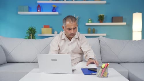 Home office worker man taking a break from his work.