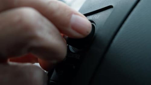 Hands Raising Up The Volume In The Car