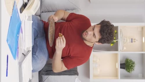 Man Eats at Desk with Upset Stomach