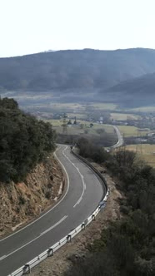 Drone View of a Road Between Valleys