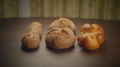 Fresh Bread Rolls on Wooden Table